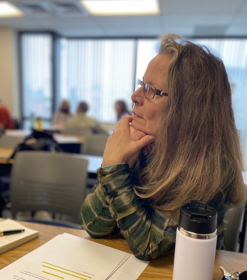 Side view of Susan in the classroom