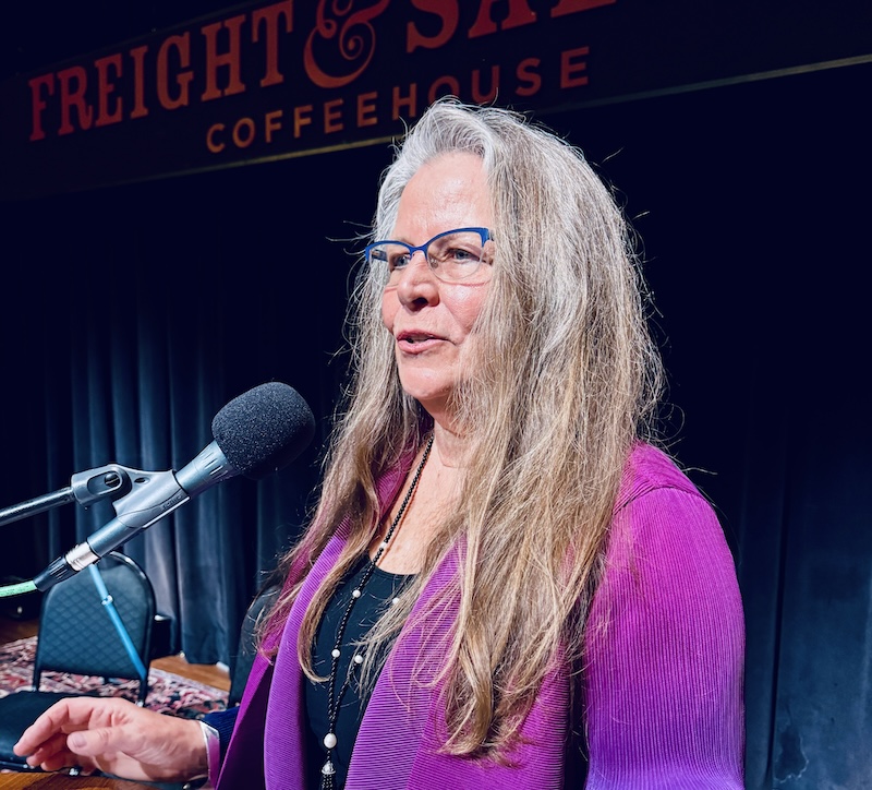 Susan Hoffman speaking at a lectern at The Freight