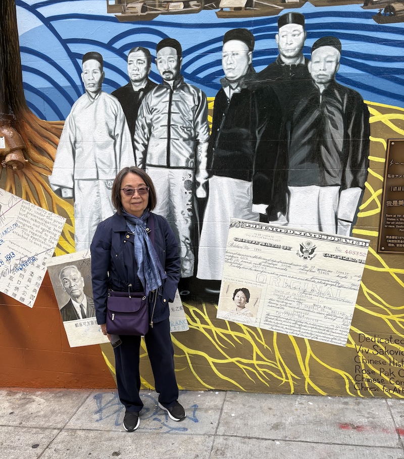 Linda Wing standing in front of the new mural